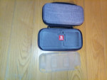 Nintendo Switch Lite with games cases controller
