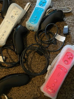 Nintendo Wii  Remotes + Nunchucks