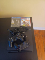 New-ish PS4 slim 1tb, 2 controllers, games (last of us)