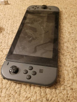 Nintendo Switch with 12 Hard copy Games with plug in controllers
