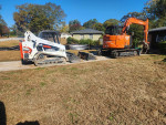 Demolition houses, mobile trailer, garage, cleaning up stream beds