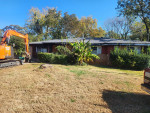 Demolition houses, mobile trailer, garage, cleaning up stream beds
