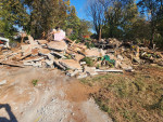 Demolition houses, mobile trailer, garage, cleaning up stream beds