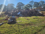 Demolition houses, mobile trailer, garage, cleaning up stream beds