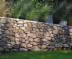 LANDSCAPING CONSTRUCTION & SPRING CLEAN UP BOOK NOW PAVER RETAING WALL
