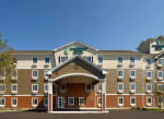 Interior entry Woodspring Suites studios from $430 with 28 night min.