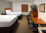 Interior entry Woodspring Suites studios from $430 with 28 night min.