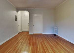 A clean, retro two-bedroom, one bath house with carport, small fenced