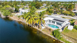HOME, SITUATED ON A FENCED LOT WITH A SOLAR HEATED POOL NEW FLOORS +