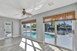 HOME, SITUATED ON A FENCED LOT WITH A SOLAR HEATED POOL NEW FLOORS +