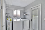 HOME, SITUATED ON A FENCED LOT WITH A SOLAR HEATED POOL NEW FLOORS +