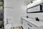HOME, SITUATED ON A FENCED LOT WITH A SOLAR HEATED POOL NEW FLOORS +