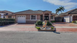 "Stunning 4/2 Home in Tamiami: Spacious, Fully-Tiled with Laminate Flo