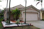 HOME WITH STAINLESS STEEL APPLIANCES. TILE & WOOD FLOORING IN BEDROOMS