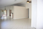 HOME WITH STAINLESS STEEL APPLIANCES. TILE & WOOD FLOORING IN BEDROOMS