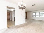 Living area is adorned with a cozy fireplace.