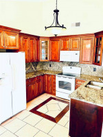 OPEN-CONCEPT HOME FLOOR PLAN WITH TILE FLOORING KITCHEN WITH GRANITE
