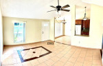 OPEN-CONCEPT HOME FLOOR PLAN WITH TILE FLOORING KITCHEN WITH GRANITE