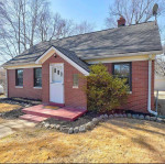 Nestled on a 2.1 acre lot with mature trees, extra parking and lovely