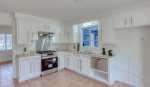 This is 2 spacious bedrooms with walk-in closets, a remodeled 1 bath