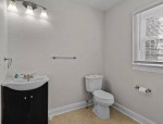 Large open floor plan living, dining, kitchen, half bath.
