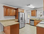 Large open floor plan living, dining, kitchen, half bath.