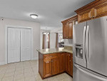 Large open floor plan living, dining, kitchen, half bath.