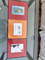 Metal frame glass top coffee table and end table with picture frame holder