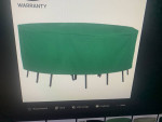 Like New. Green Atruim Large Patio Round Table and Chair Set cover.