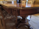 Carved wood formal dining table with  marquetry, double pedestal base