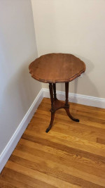 Three-legged circular side table in wood