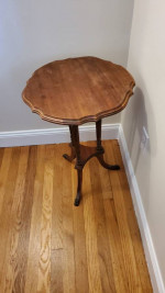 Three-legged circular side table in wood