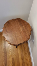Three-legged circular side table in wood