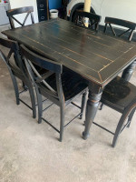 High top black rustic dining table with 6 chairs and a leaf