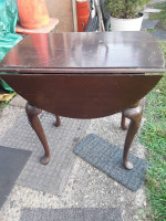 Drop leaf table with carved legs