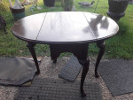 Drop leaf table with carved legs