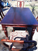 Very nice ornate 4 chair solid dark wood dining table