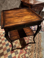 A beautiful high end hooker side table with a shelf and drawer