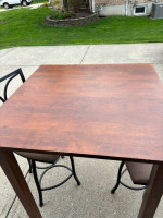 High table and swivel chairs