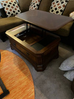 Coffee table with lift up top