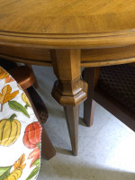 Wood dining table 42” has one leaf