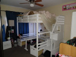 White high full size bunk bed with picnic table bottom and storage