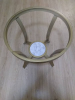 Glass-top end table with gold base & faux marble storage space below