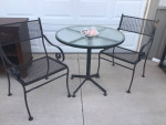 Metal and glass table with chairs