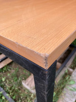 Large square table. Black metal base. Good condition