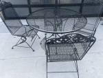 Classic wrought iron patio set. Dining table with four chairs