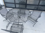 Classic wrought iron patio set. Dining table with four chairs