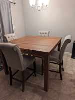 Bar height table and tufted chairs set