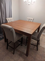 Bar height table and tufted chairs set