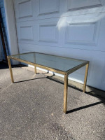 Glass topped gold framed coffee table